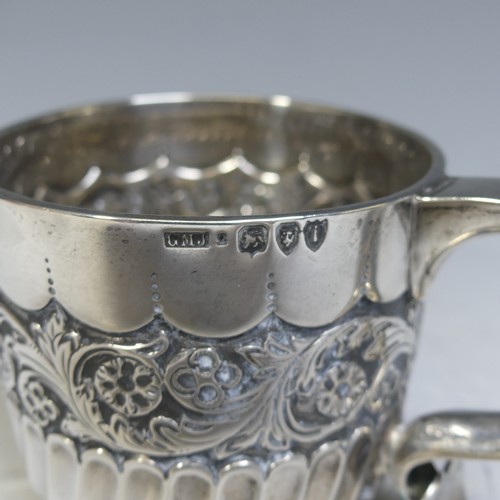 84 - A Victorian silver Mug, by Josiah Williams & Co., hallmarked London, 1894, demi-fluted with a ce... 