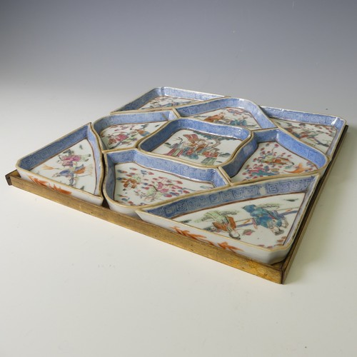 A late 19thC Chinese porcelain Hors D'Oeuvres Set, comprising nine dishes forming a square shape, each one depicting figures enclosed within greek key border, all contained within a gilded tray, W 28cm x D 28cm.