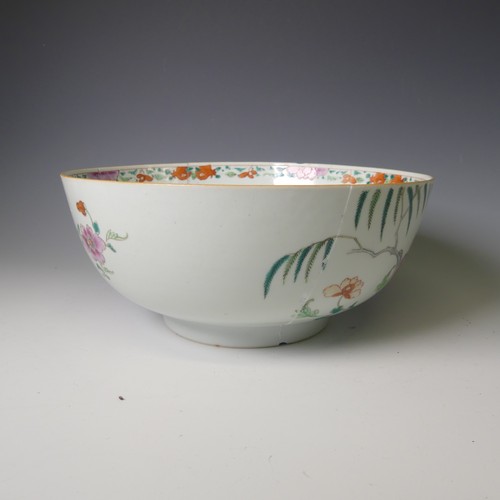 140 - A 19thC Chinese porcelain famille rose Bowl, decorated with figures and fauna enclosed with scale de... 