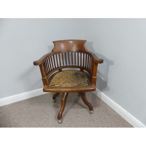 316 - An early 20thC swivel Desk Chair, with spindle back and scroll arms, above an upholstered pad seat, ... 