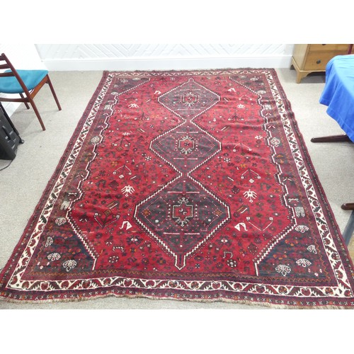 481 - Tribal rugs; a Kashquai Rug, hand-knotted with stylised tree of life and floral designs on a red gro... 