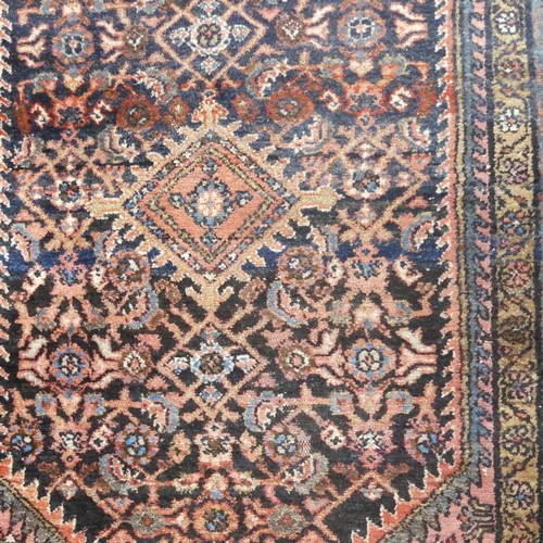 483 - Tribal rugs; an Afghan Rug, hand-knotted with tekke and geometric designs on a light red ground, 100... 