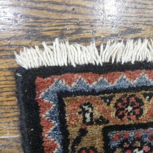 483 - Tribal rugs; an Afghan Rug, hand-knotted with tekke and geometric designs on a light red ground, 100... 