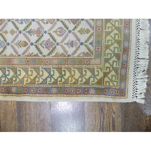 485 - Tribal rugs; a hand-knotted runner, cream ground woven with geometric designs, thick wool pile on co... 