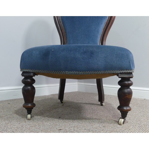 319 - A Victorian walnut nursing chair, upholstered in blue fabric, W 58cm x H 92cm x D 75cm.... 