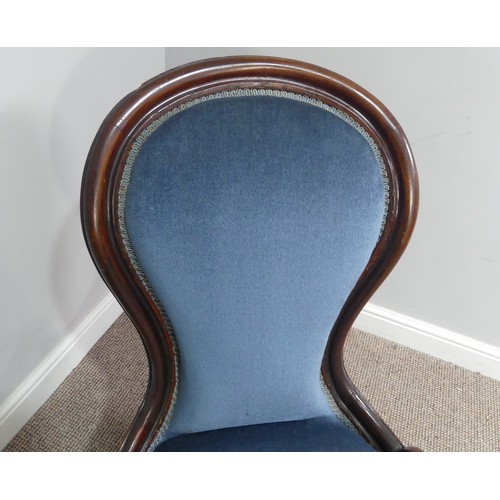 319 - A Victorian walnut nursing chair, upholstered in blue fabric, W 58cm x H 92cm x D 75cm.... 