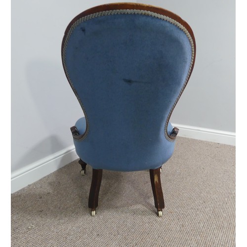 319 - A Victorian walnut nursing chair, upholstered in blue fabric, W 58cm x H 92cm x D 75cm.... 