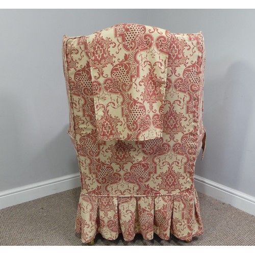 323 - An early 20thC oak framed wing Armchair, with patterned upholstery, the wings above outswept arms, o... 