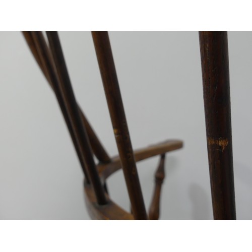 328 - A late 19th century ash and elm Windsor Chair, with stick back and shaped seat, on turned legs joine... 