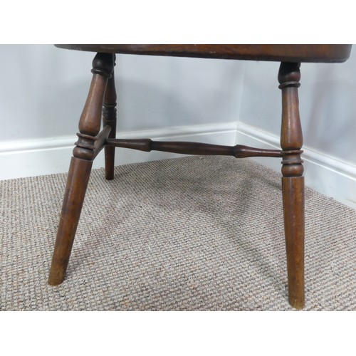 328 - A late 19th century ash and elm Windsor Chair, with stick back and shaped seat, on turned legs joine... 