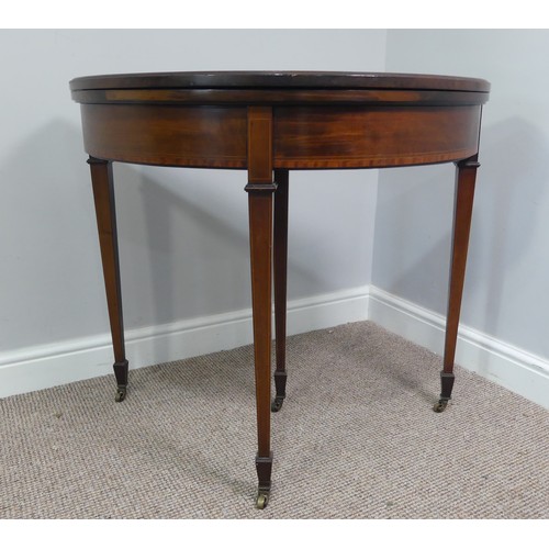 331 - An Edwardian mahogany inlaid demi-lune Card Table, with fold-over top lined with baize, raised on sq... 