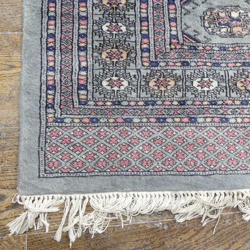 487 - Tribal Rugs; a finely hand-knotted Bokhara rug, grey ground, wool pile on cotton base, 126cm x 202cm... 