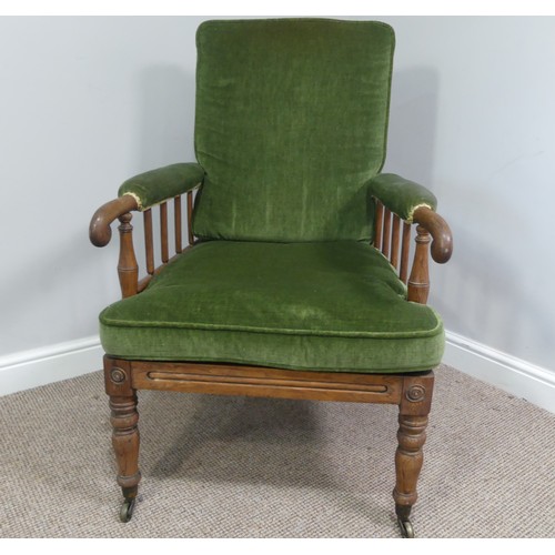 332 - A Victorian pitch pine framed Armchair, with stick back and scroll arms, upholstered green armrests,... 