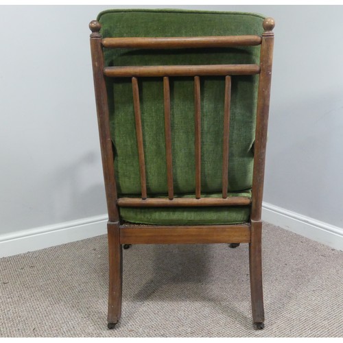 332 - A Victorian pitch pine framed Armchair, with stick back and scroll arms, upholstered green armrests,... 