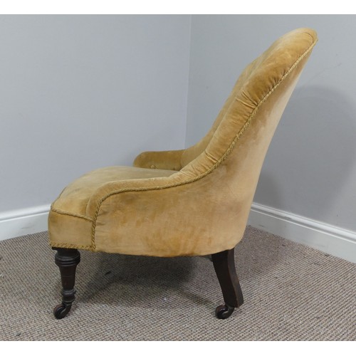 333 - A Victorian upholstered Nursing Chair, with yellow velvet upholstery, on turned front legs with cast... 