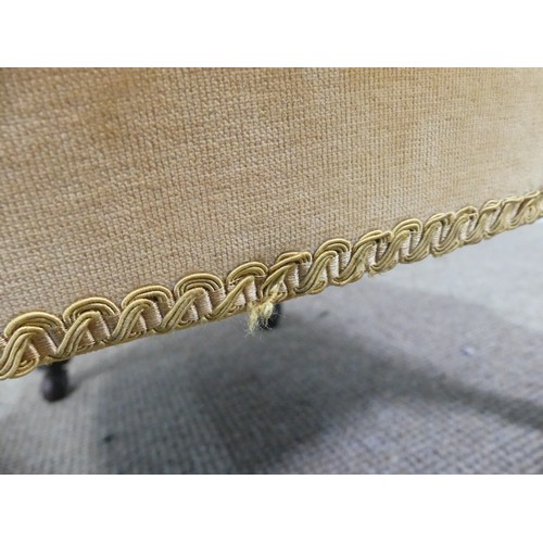 333 - A Victorian upholstered Nursing Chair, with yellow velvet upholstery, on turned front legs with cast... 