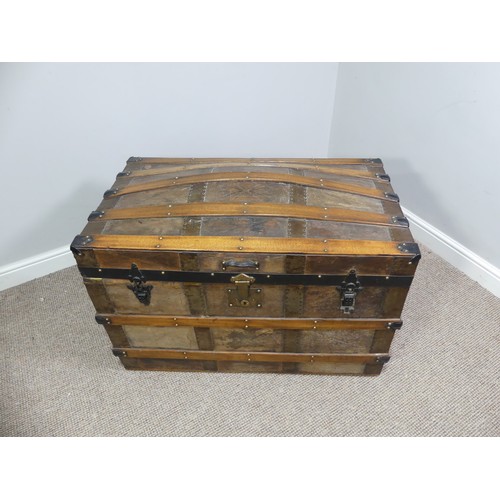 334 - A Victorian metal bound dome-topped Trunk, with leather carrying handles, W 92cm x D 52cm x H 65cm.... 