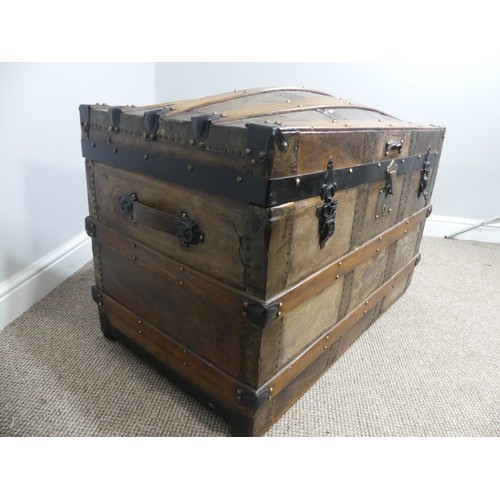 334 - A Victorian metal bound dome-topped Trunk, with leather carrying handles, W 92cm x D 52cm x H 65cm.... 