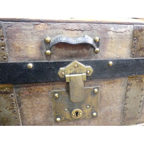 334 - A Victorian metal bound dome-topped Trunk, with leather carrying handles, W 92cm x D 52cm x H 65cm.... 