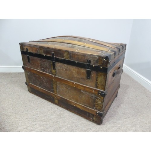 334 - A Victorian metal bound dome-topped Trunk, with leather carrying handles, W 92cm x D 52cm x H 65cm.... 