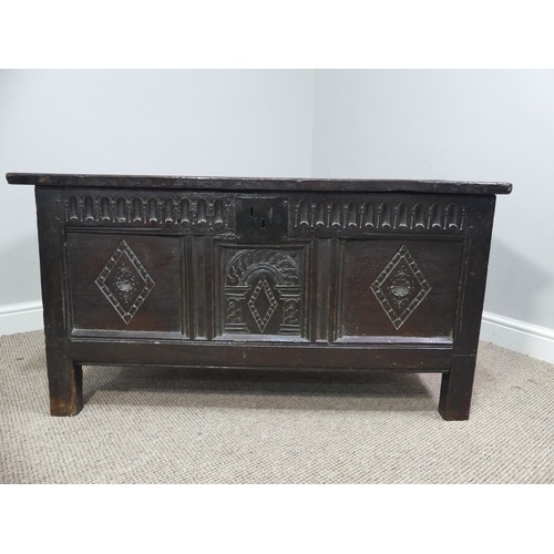 337 - A 17th century oak three panel Coffer, the front with carved panels below a carved frieze, on square... 