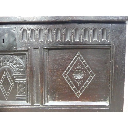 337 - A 17th century oak three panel Coffer, the front with carved panels below a carved frieze, on square... 