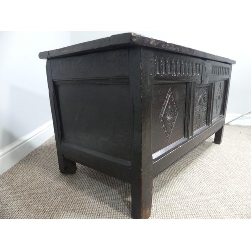 337 - A 17th century oak three panel Coffer, the front with carved panels below a carved frieze, on square... 