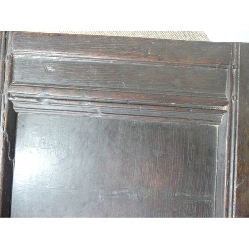 337 - A 17th century oak three panel Coffer, the front with carved panels below a carved frieze, on square... 