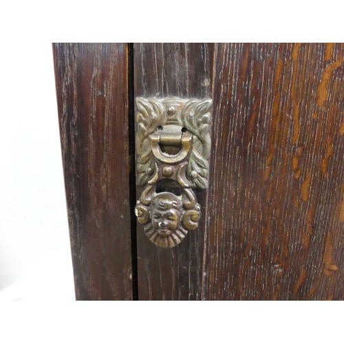 339 - Two associated oak bedside cupboards paired with a 19thC mahogany toilet mirror, latch on the conver... 