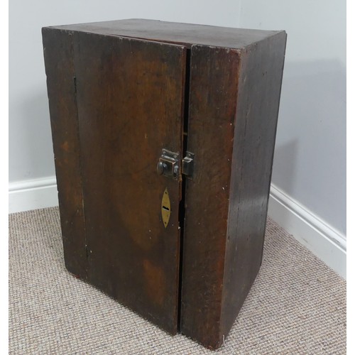 339 - Two associated oak bedside cupboards paired with a 19thC mahogany toilet mirror, latch on the conver... 