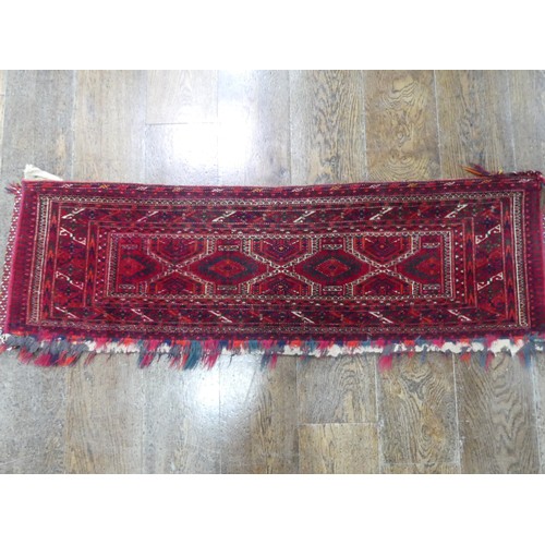 488 - Tribal Rugs; a Baluchi Tent Hanging, finely knotted with short pile, edges and fringing worn, 135cm ... 