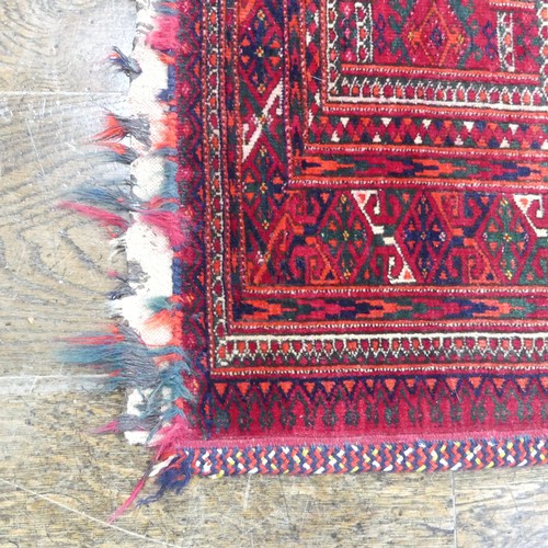 488 - Tribal Rugs; a Baluchi Tent Hanging, finely knotted with short pile, edges and fringing worn, 135cm ... 