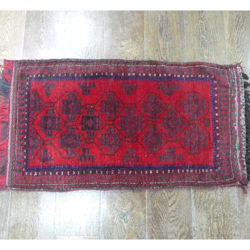 488 - Tribal Rugs; a Baluchi Tent Hanging, finely knotted with short pile, edges and fringing worn, 135cm ... 