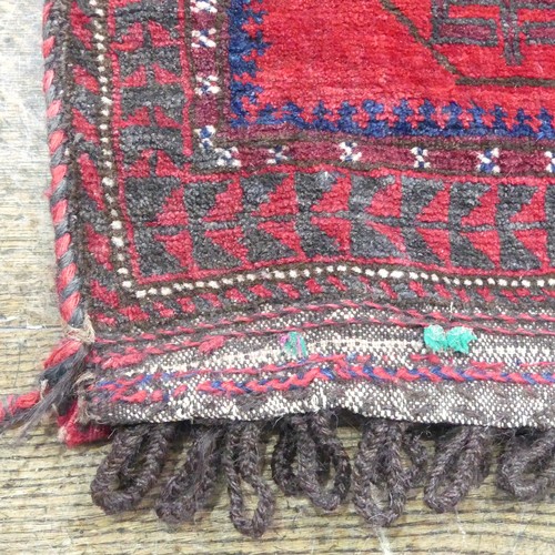 488 - Tribal Rugs; a Baluchi Tent Hanging, finely knotted with short pile, edges and fringing worn, 135cm ... 