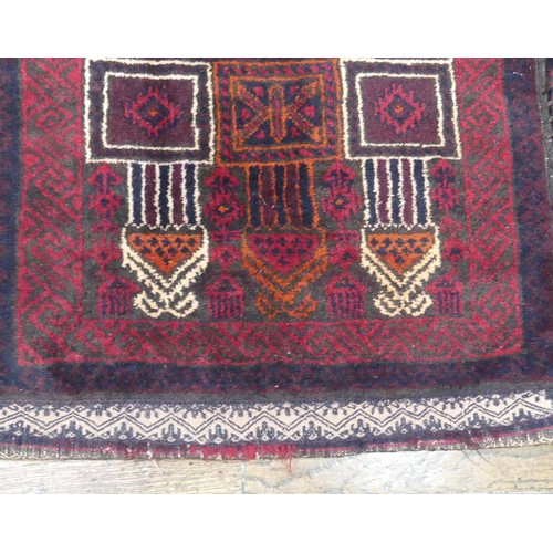 488 - Tribal Rugs; a Baluchi Tent Hanging, finely knotted with short pile, edges and fringing worn, 135cm ... 