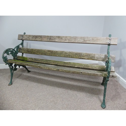 494 - Garden Furniture; a vintage green-painted cast iron Garden Seat, the bench ends in the Coalbrookdale... 