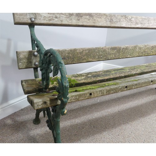 494 - Garden Furniture; a vintage green-painted cast iron Garden Seat, the bench ends in the Coalbrookdale... 