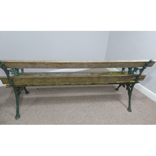 494 - Garden Furniture; a vintage green-painted cast iron Garden Seat, the bench ends in the Coalbrookdale... 