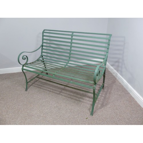 496 - Garden Furniture; a vintage green-painted 'Park' Bench style cast iron Garden Seat, with curved back... 