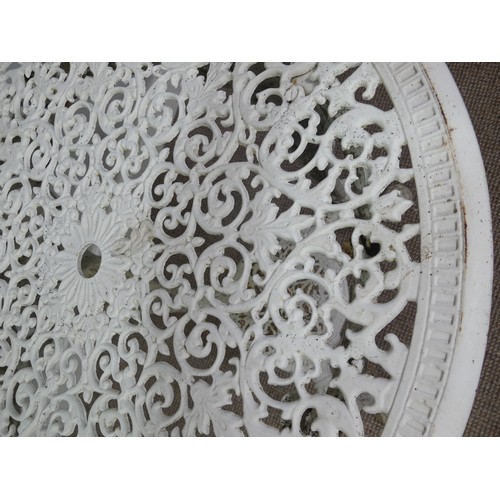 497 - Garden Furniture; a vintage white painted cast iron circular Garden Table, with under tier on heavil... 