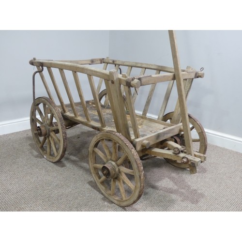 342 - A vintage four wheeled wooden dog/ log Cart, in weathered condition, W 120cm x D 62cm (wheel to whee... 