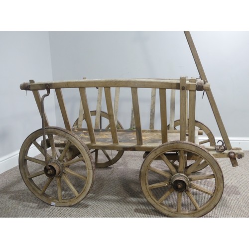 342 - A vintage four wheeled wooden dog/ log Cart, in weathered condition, W 120cm x D 62cm (wheel to whee... 