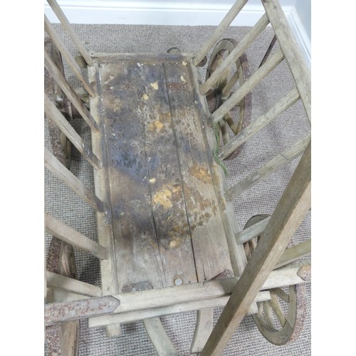 342 - A vintage four wheeled wooden dog/ log Cart, in weathered condition, W 120cm x D 62cm (wheel to whee... 