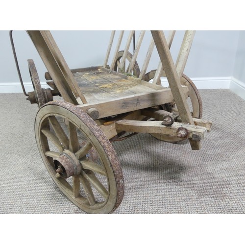 342 - A vintage four wheeled wooden dog/ log Cart, in weathered condition, W 120cm x D 62cm (wheel to whee... 