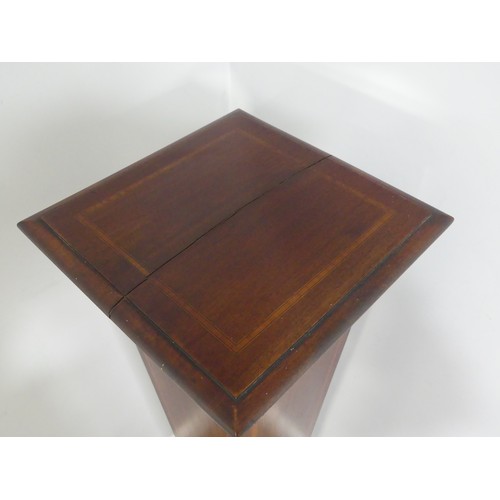 349 - An Edwardian inlaid mahogany torchere plant stand, has a split top. W 31cm x H 118cm x D 31cm.... 