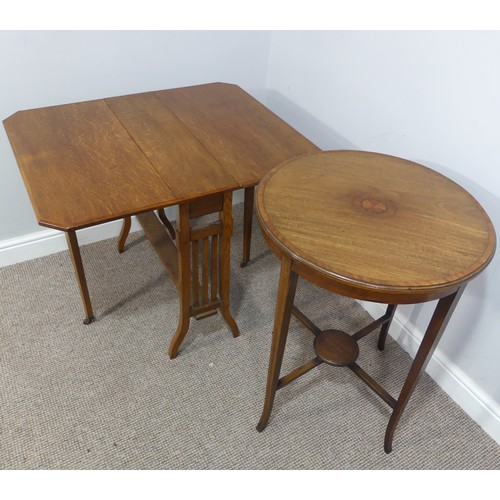 352 - An Edwardian oak Sutherland table, with canted corners to the rectangular top mounted on square legs... 