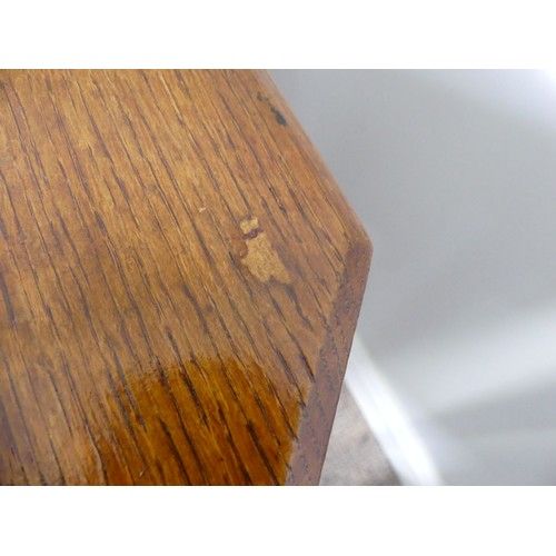 352 - An Edwardian oak Sutherland table, with canted corners to the rectangular top mounted on square legs... 