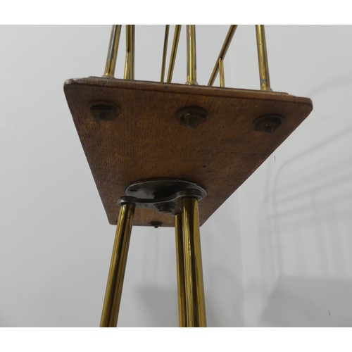 353 - An early 20th century brass and oak Magazine Stand, W 37cm x H 79cm x D 37cm.