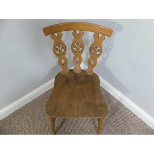 356 - A set of four vintage ash kitchen chairs, all with carved backs, one chair has a different shaped se... 