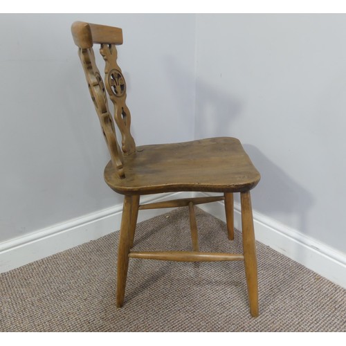 356 - A set of four vintage ash kitchen chairs, all with carved backs, one chair has a different shaped se... 